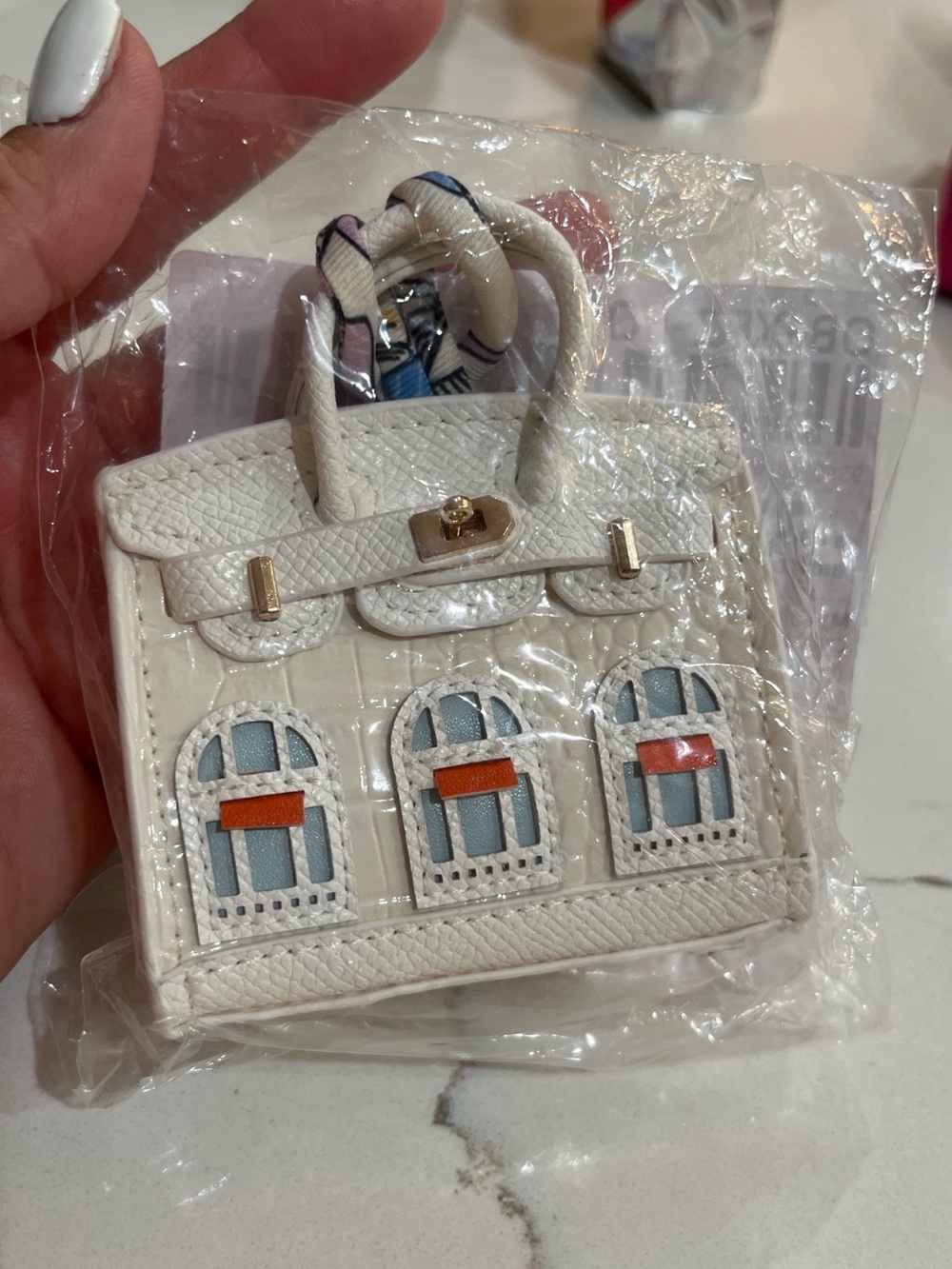 Mini White Women's Top-Handle Bag Keychain with Blue Accents #earpodcase
